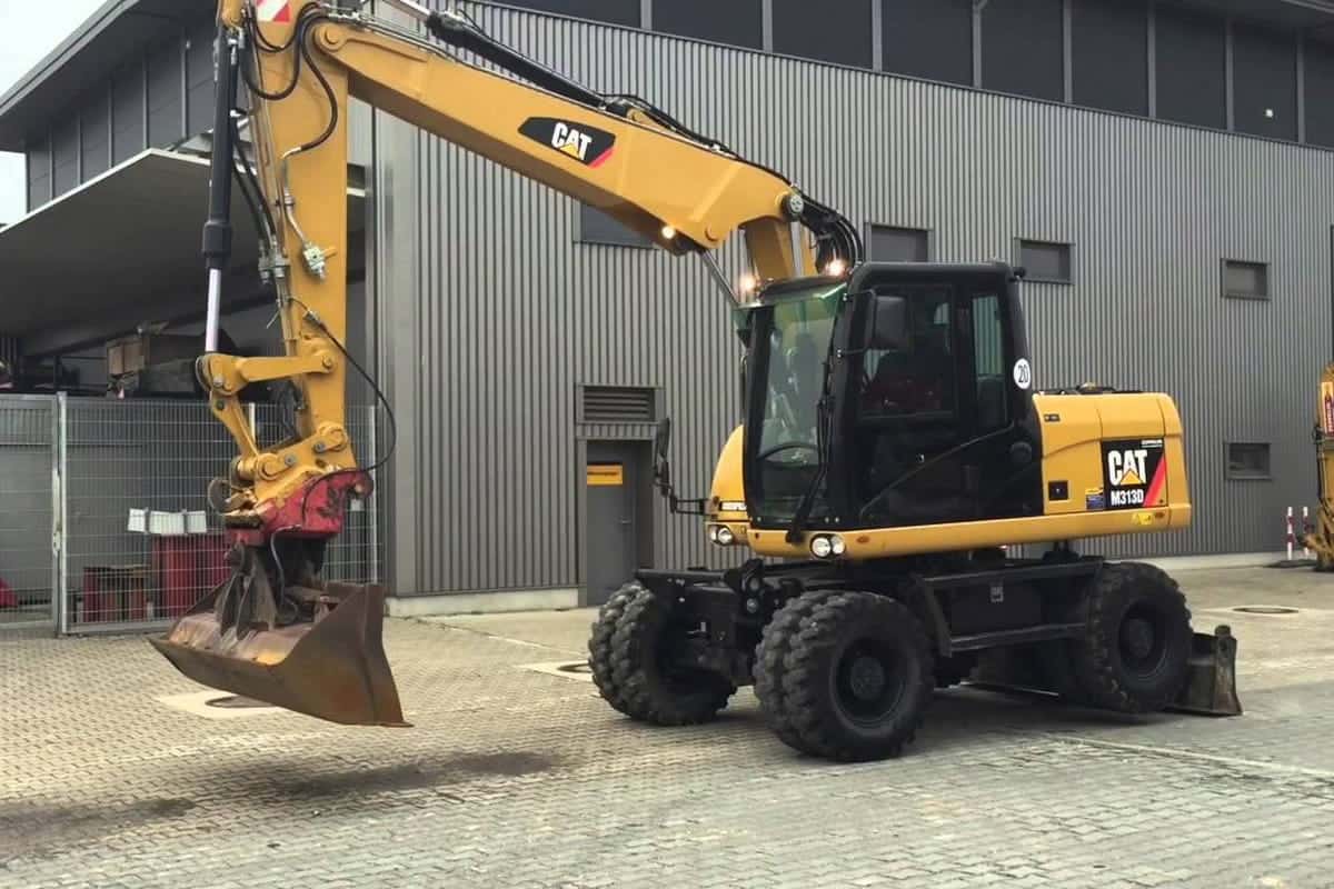 Аренда экскаватора колесного CAT M313